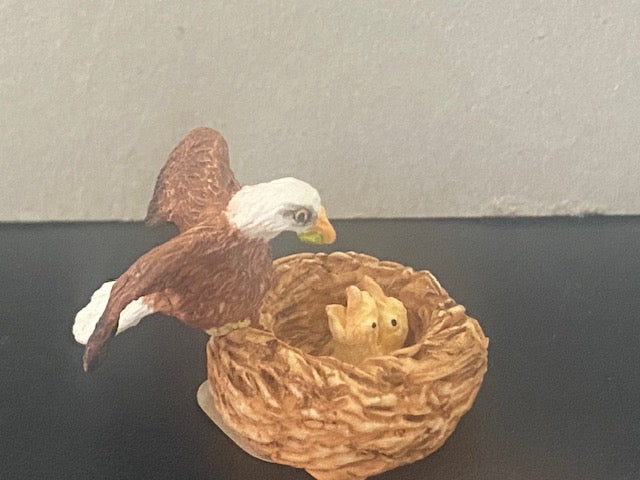 Eagle with babies in nest