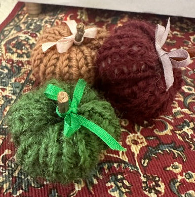 Set of 3 hand knitted pumpkins-approx 1" in diameter