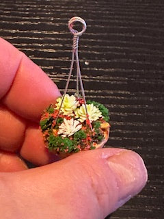 Hanging Basket with red and white flowers and greenery