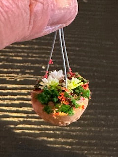 Hanging Basket with red and white flowers and greenery