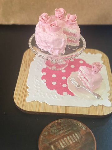 Pink cake with rosettes