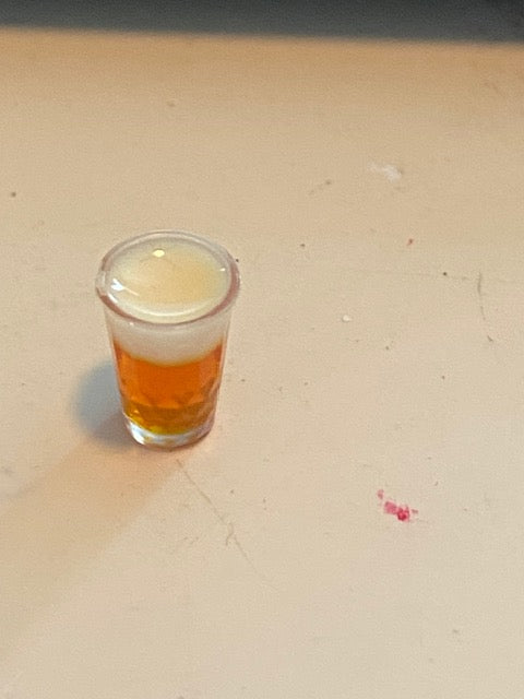 Single glass of beer with foam