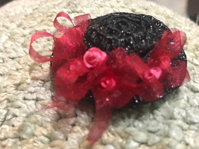 Black and red Hat designed by retired artist M3