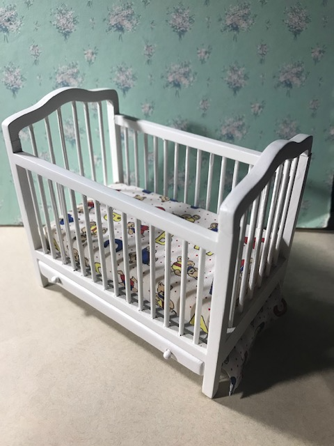 White Crib with hidden drawer